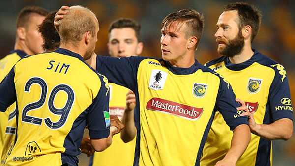 Central Coast Mariners celebrate after Nick Fitzgerald's opening goal.