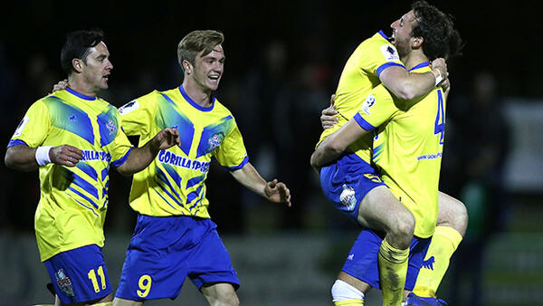 Brisbane Strikers celebrate after scoring in their extra time win over Broadmeadow Magic.