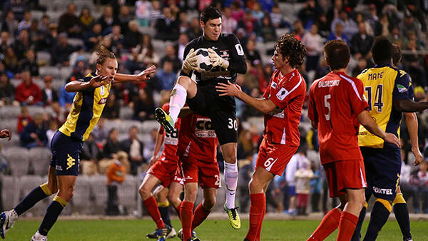 Wolves goalkeeper Daniel Collison makes a save against the Mariners.