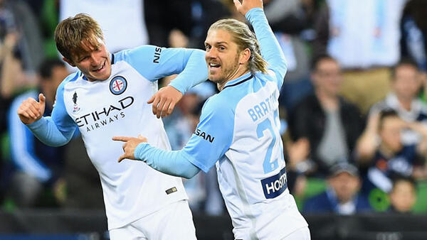 Luke Brattan celebrates with Nick Fitzgerald after scoring City's opener against Victory.