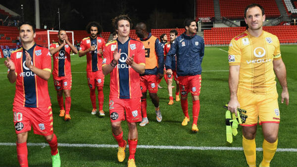 Adelaide United celebrate their win over Sydney FC at Coopers Stadium.