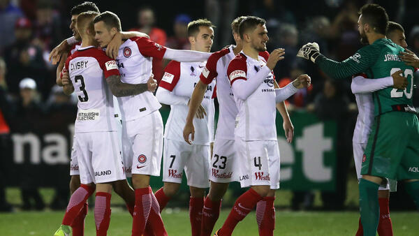 Wanderers players celebrate following their win over Blacktown City.