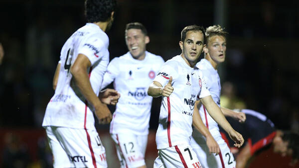 Wanderers players celebrate a goal in their 5-1 win over Edgeworth.