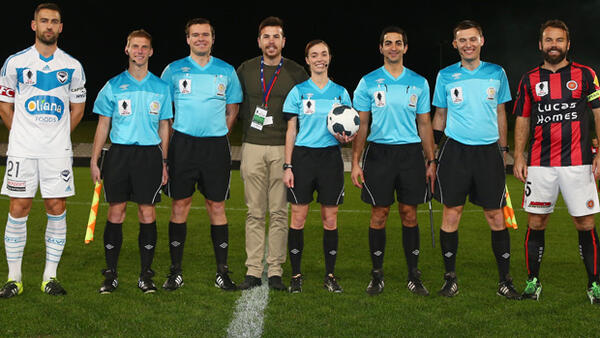 Melbourne Victory captain Carl Valeri poses alongside Suns player-coach Paul Reid.