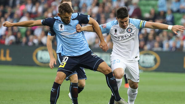 Milos Ninkovic challenges for the ball with Bruno Fornaroli in the FFA Cup Final.