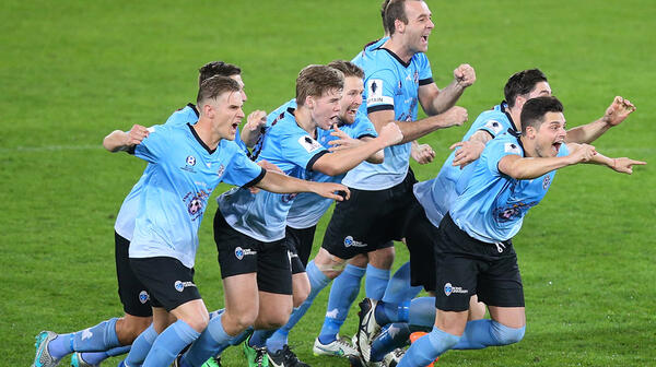 Palm Beach players celebrate after beating South Melbourne on penalties.