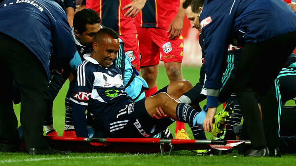 Archie Thompson is stretchered off AAMI Park after injuring his knee in the Westfield FFA Cup.