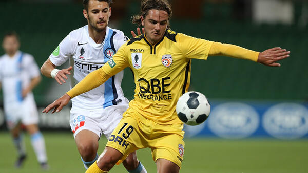Glory defender Josh Risdon controls the ball ahead of City midfielder Steve Kuzmanovski.