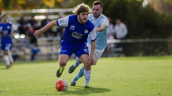 Tom McLachlan of Olympic playing against Belconnen earlier this season
