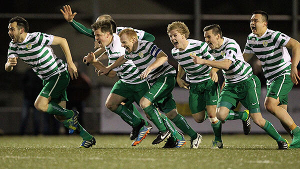 Tuggeranong United players celebrate after defeating South Hobart on penalties.