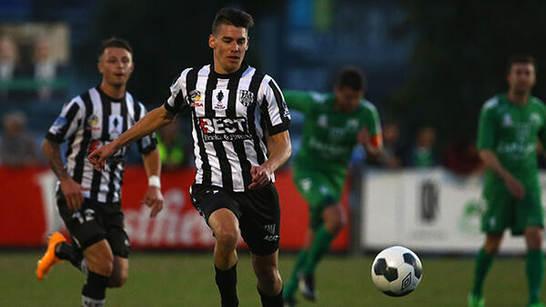 Joel Allwright of Adelaide City in action against Bentleigh Greens.