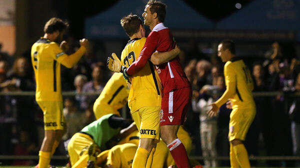 Ante Covic celebrates with Michael Thwaite after Glory's shootout win over the Wanderers.