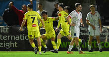 Wellington Phoenix celebrate the winner against Peninsula Power in Australia Cup