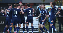 Oakleigh Cannons celebrate scoring against Melbourne City in 2023