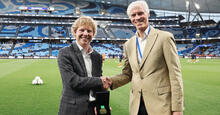 Hamish Gow is presented the Mike Cockerill Medal by Ian Cockerill during the 2023 Australia Cup Final match between Sydney FC and Brisbane Roar FC at Allianz Stadium on October 07, 2023