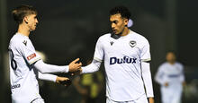 Nishan Velupillay of Victory (R) celebrates scoring a goal during the 2024 Australia Cup Round of 32 match between Lambton Jaffas FC and Melbourne Victory FC at Jack MacLaughlan Oval on August 06, 2024