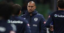 Patrick Kisnorbo watches his Melbourne Victory team warm up ahead of the Australia Cup Final 2024